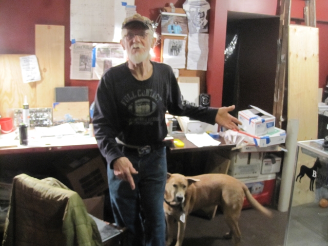 Power with his dog Jessie Jane in his studio space on E. 5th Street.
