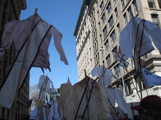 Shirtwaists bearing the names of the fire's 146 victims flew in front of the former Triangle Factory at Washington Square Park.