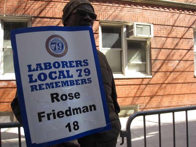 Local Labor union members carried placards remembering victims.