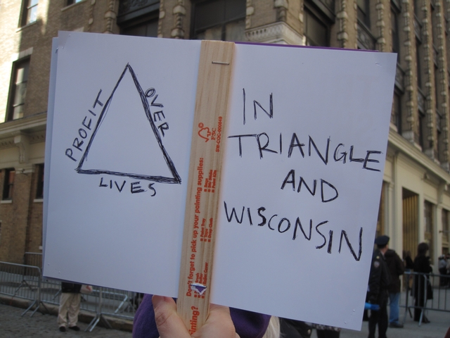 Wisconsin protest sign held at the 100th anniversary of Triangle fire.