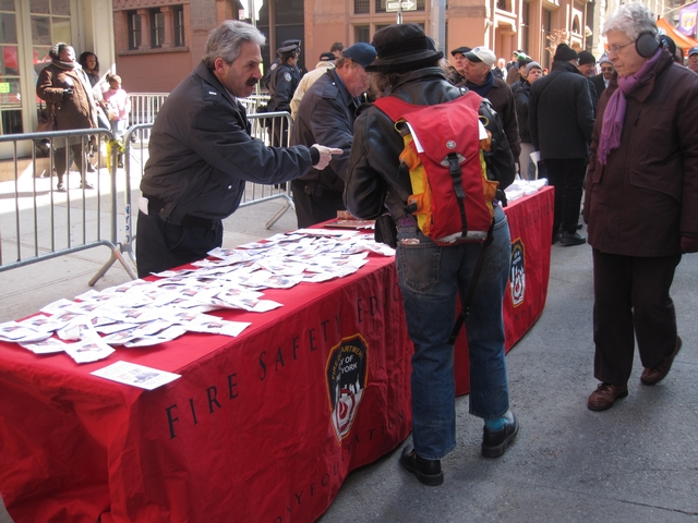 The FDNY passes out fire safety information.