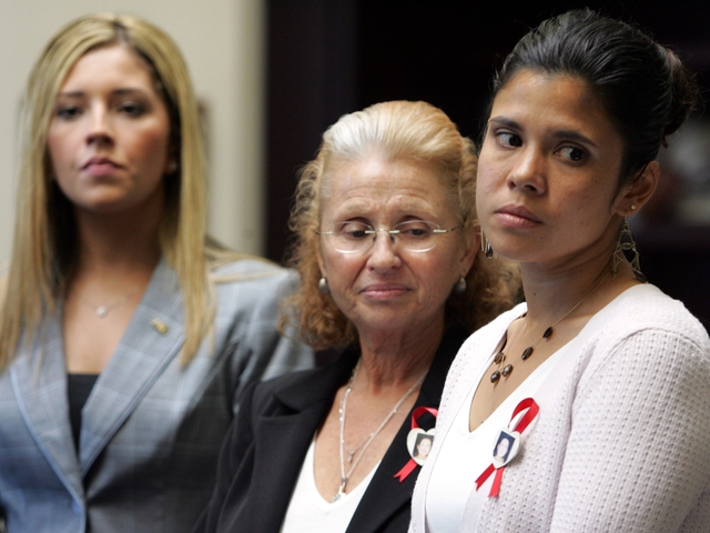 Maureen St. Guillen, (C), and Alejandra St. Guillen (R) attend a news conference at the John Jay College of Criiminal Justice, June 4, 2006.