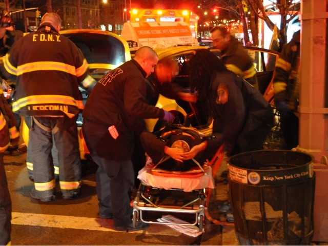 FDNY paramedics tend to an injured driver after a car accident at 92nd Street and Broadway Sunday morning.