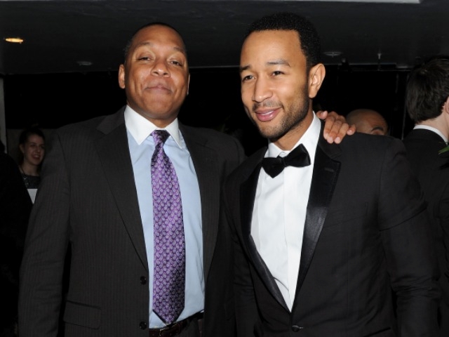 Musicians Wynton Marsalis and John Legend posed at a dinner following Marsalis' performance with guitarist Eric Clapton at Jazz at Lincoln Center.