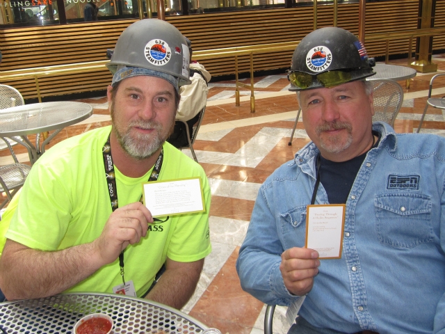 Ed Oakley, right, and Jim Hepburn, steamfitters at One World Trade Center, held up their poems.
