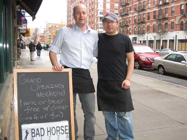 Bad Horse Pizza business partners John Kandel and Omar Guzman outside the restaurant.