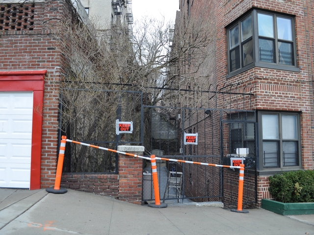 The West 558 W. 218th Street entrance has been blocked since the Department of Building's issued its partial evacuation order.