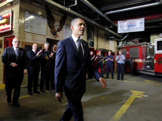 President Barack Obama is followed by former New York City mayor Rudy Giuliani (L) as he greets members of the New York City Fire Department at the Engine 54 firehouse on May 5, 2011 in New York City.