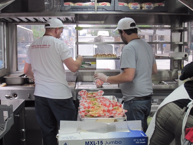 A line of lobster rolls ready to serve.