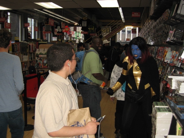 A customer at Midtown Comics is surprised by a colorful greeter on Free Comic Book Day on Saturday, May 7, 2011.
