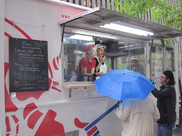 Lobster lovers brave the rain for a taste.