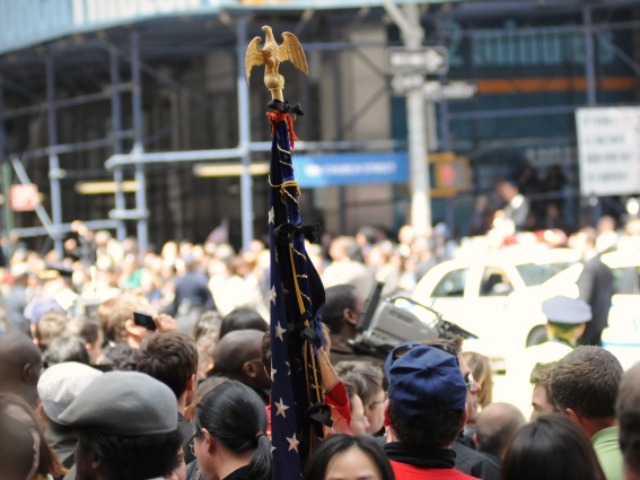 The flag is on display in a massive crowd near Ground Zero Thursday.