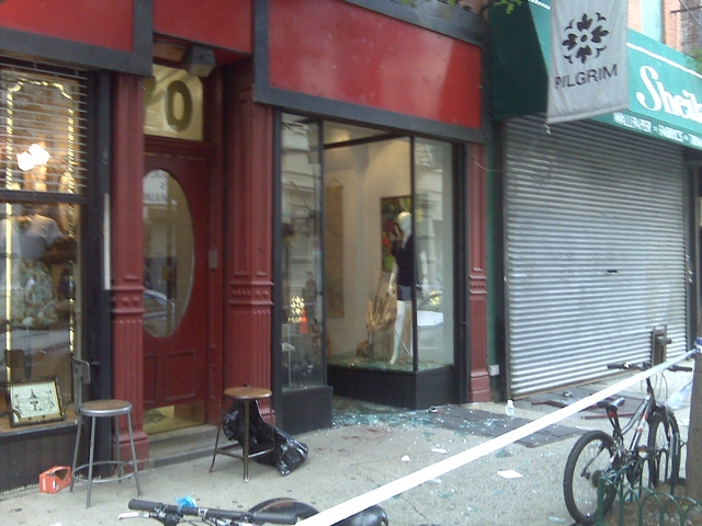 Shattered glass covers the sidewalk in front of Pilgrim vintage clothing store at 70 Orchard St.
