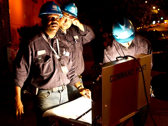 Con Edison workers try to reinstate power.