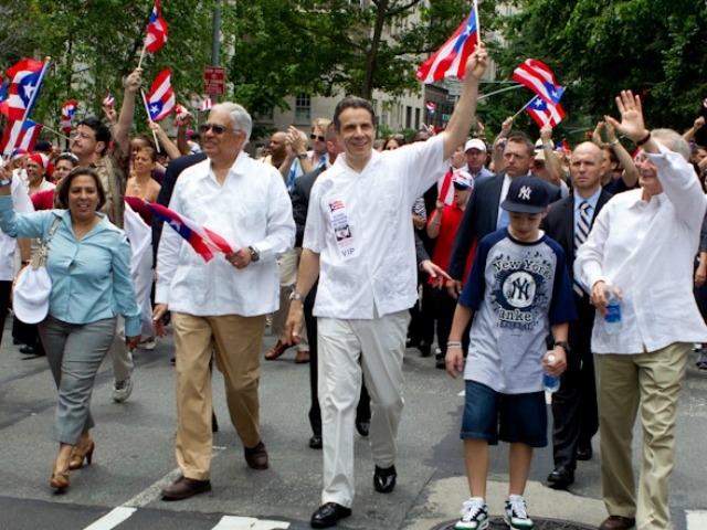 Gov. Andrew Cuomo (center, in white), joins the festivities.