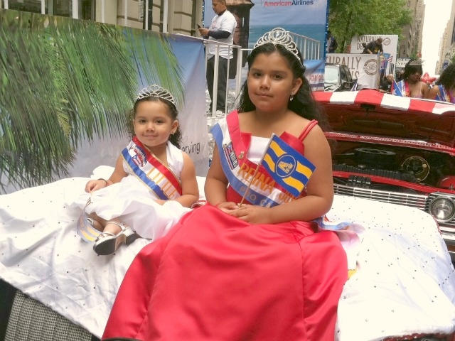 Cute. Shasha Cevallos, 3, (l.) and her sister, Mercedes, 10, are representing the Puerto Rican town of Casa Guanica.