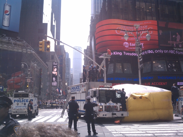 A man on a traffic light pole shut down Times Square on Tuesday.