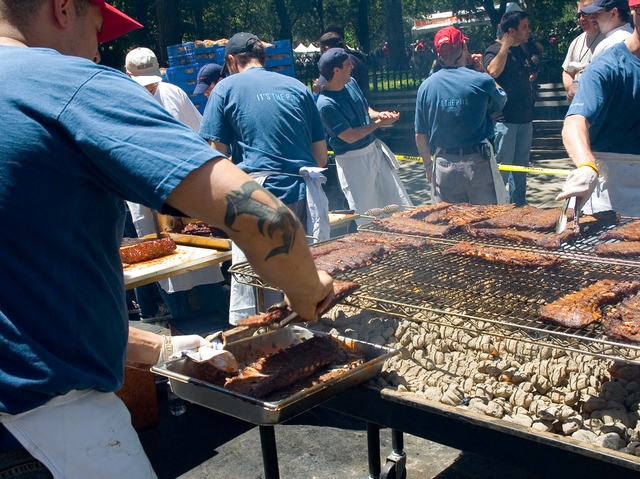 Blue Smoke chefs warming some ribs during the Fourth Annual Big Apple BBQ Block Party.