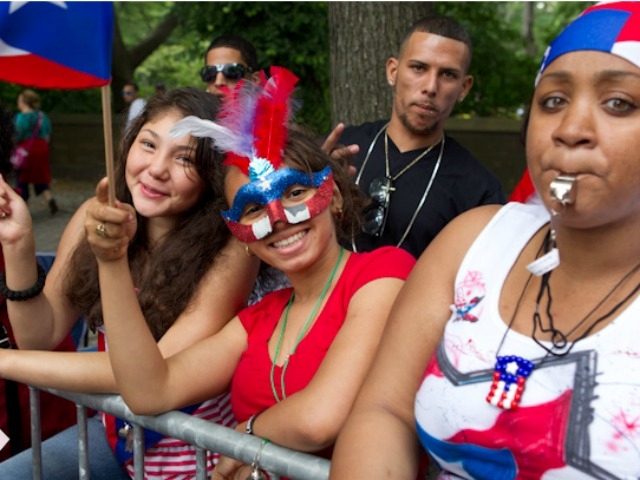 Pals Gizzel George, 13, Iveliz Hernandez, 14, and Michelina Nevarez, 20, all from Nassau County take in the sights & sounds of the parade this morning on 5th Ave.