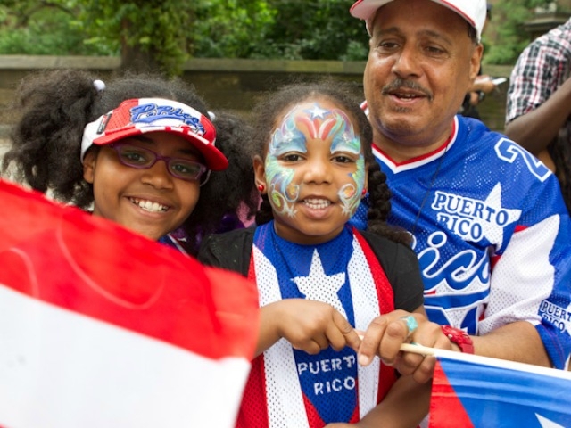 Manuel Olivo, 58, from Harlem with his kids D'Laja, 10, and Tia'Jai, 4.