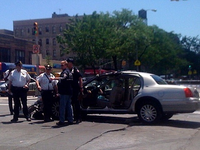 Cops investigate aftermath of crash at W. 145th Street and Seventh Avenue.