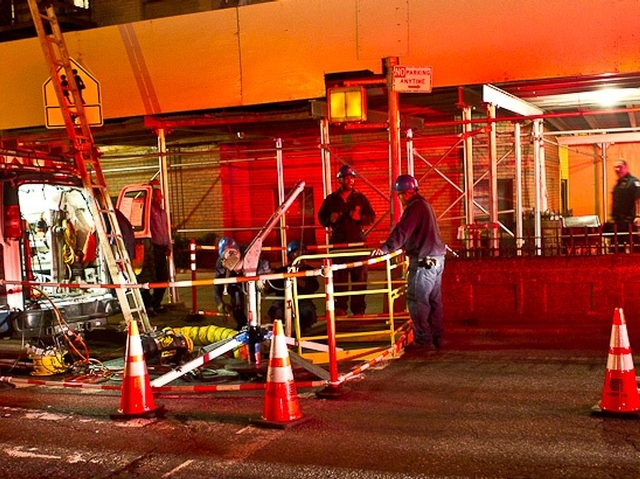 The street is closed as workers tries to reinstate power.
