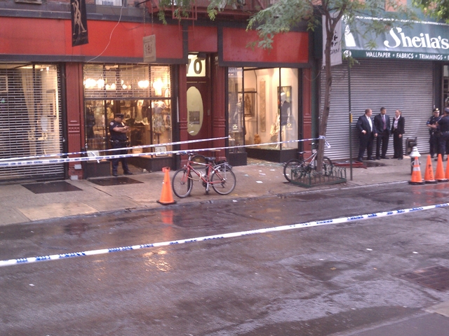 Police stand outside Pilgrim at 70 Orchard St. after an attempted robbery inside.