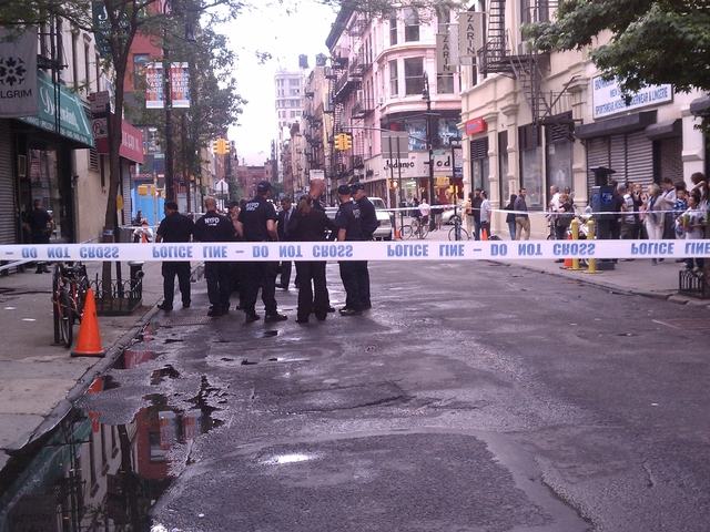 Police close off Orchard Street near Broome Street after a shopowner was wounded in an apparent attempted robbery.