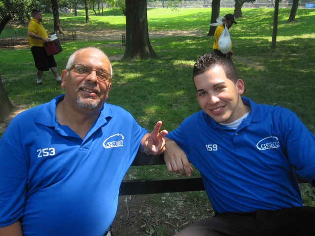 Edgar Torres, 56, (left) and Aramis Marte, 23, signed up to work security for the Black Eyed Peas concert in Central Park on Thursday.
