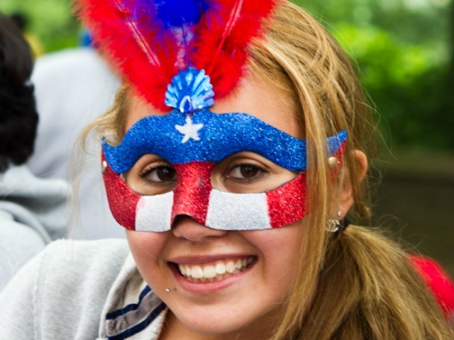 Brianna Bacon, 18, from Providence, RI celebrates her graduation enjoying the parade.