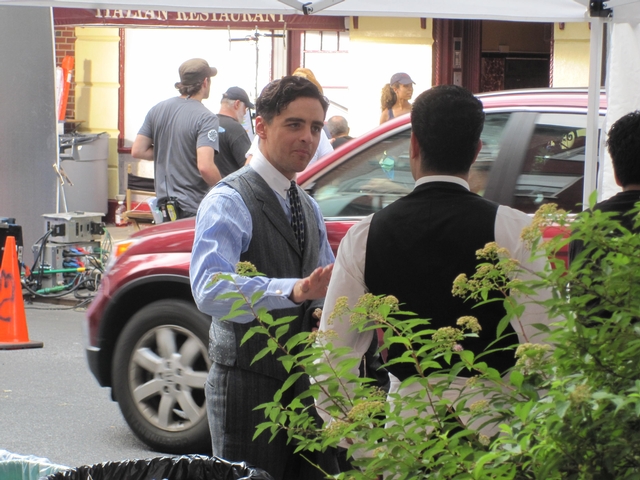 Vincent Piazza, who plays Lucky Luciano, chatted with a cast-member in between takes.