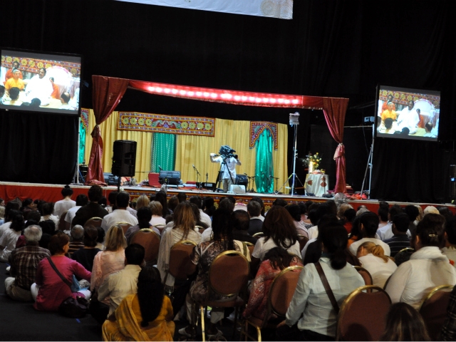 Some of Amma's followers began the morning in meditation inside Manhattan Plaza, while others waited in line for hugs.