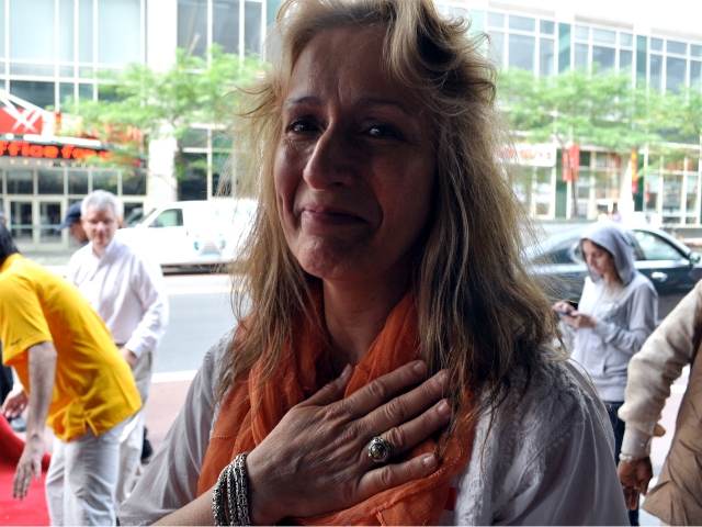 Ann Reilly, 59, sighed after watching Amma walk by on the red carpet.