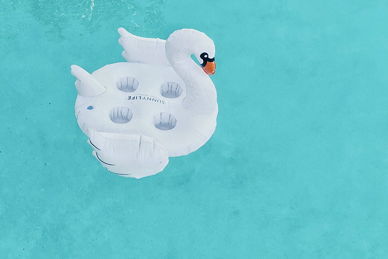 Swimming, Summer and Curls: Product Review swan raft in pool
