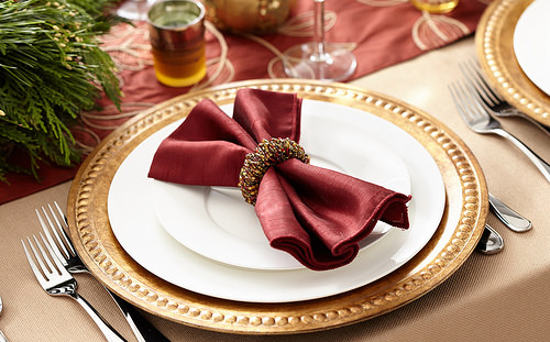 Thanksgiving table setting with napkin, napkin ring silverware and plates by ProFlowers.com napkins photo