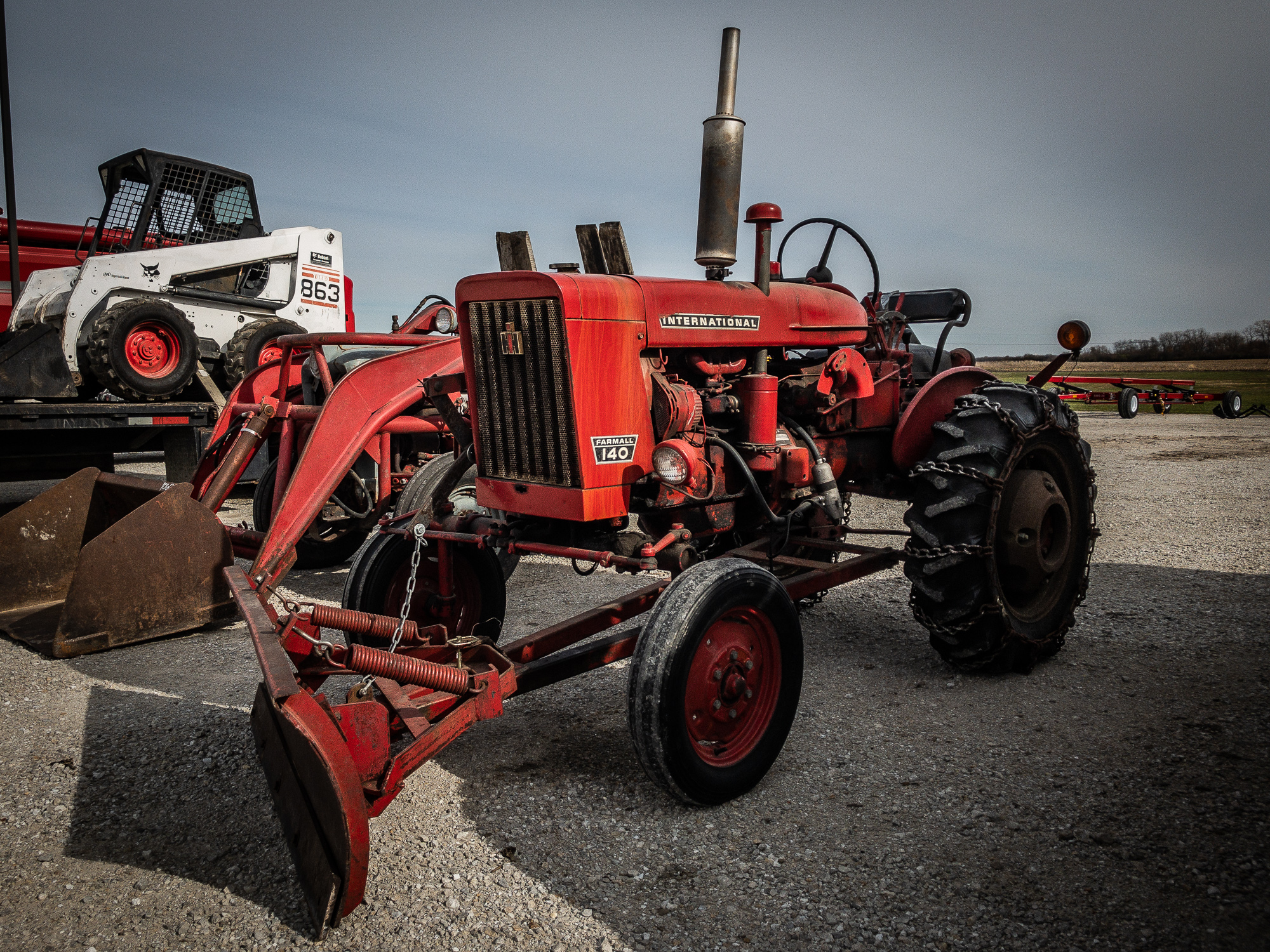 Check out this red tractor we found on our Urbana lot