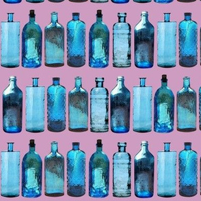 blue glass bottles on pink