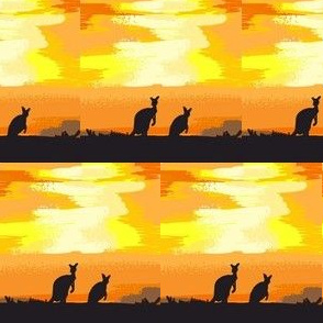 kangaroos crossing the desert at dusk
