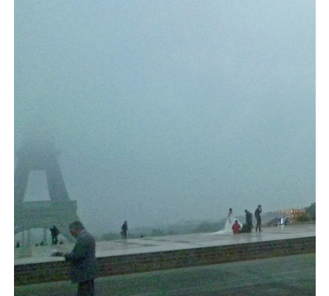 Newly Weds in front of Fogged-in Eiffel Tower 