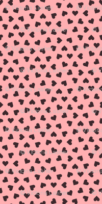 dark chocolate hearts on pink