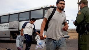 Photo of undocumented immigrants getting off the bus in Presidio so they can be deported to Ojinaga, Mexico