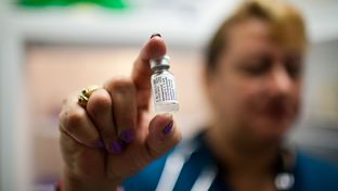 Medical assistant Patricia Jaramillo holds a vial of the meningitis vaccine, August 7, 2012 in Houston at Legacy Community Health Services. Each vial contains one dose.