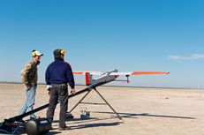 Texas A&M University-Corpus Christi engineering student Adam Ersepke and lab coordinator Jack Edward Esparza prepare for the take off of  the University’s RS-16 unmanned aerial vehicle, otherwise known as a drone, for a test flight over the Kennedy Ranch near Sarita, Texas on January 18, 2013.