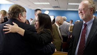 Attorneys representing Texas school districts congratulated each other after a judge ruled on Feb. 4, 2013, that the state's school finance system was unconstitutional.