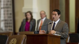Rep. Trey Martinez Fischer makes a parliamentary inquiry at the back microphone on Feb. 11, 2013.