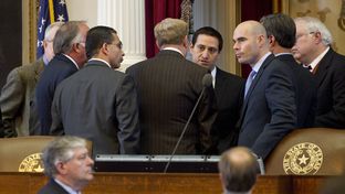 House members huddle at dais on February 14th, 2013