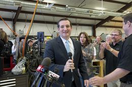 U.S. Sen Ted Cruz is welcomed at LaRue Tactical, a gun manufacturer in Leander, by founders Ellen LaRue, center, and Mark LaRue, right, on Feb. 19, 2013.