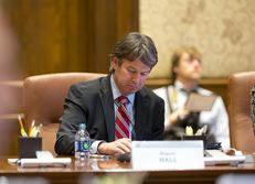 Dallas businessman Wallace Hall, Jr. takes notes at the University of Texas Board of Regents meeting on Feb. 14, 2013 in Austin.