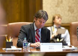 Dallas businessman Wallace Hall, Jr. takes notes at the University of Texas Board of Regents meeting on Feb. 14, 2013 in Austin.
