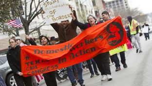 Large group for immigration reform rallies down Congress Ave. towards the Texas Capitol on February 22nd, 2013